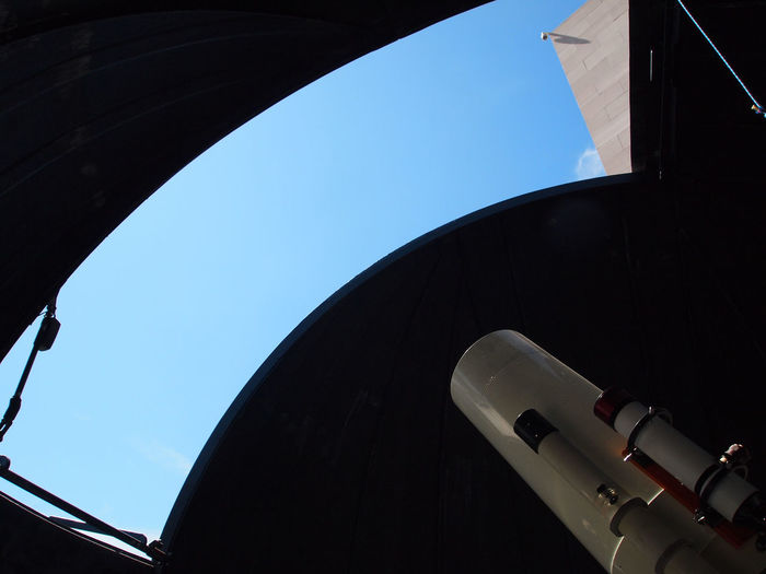 Low angle view of telescope against clear sky