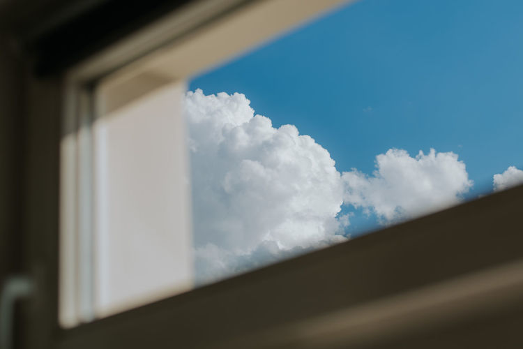 Low angle view of window against sky