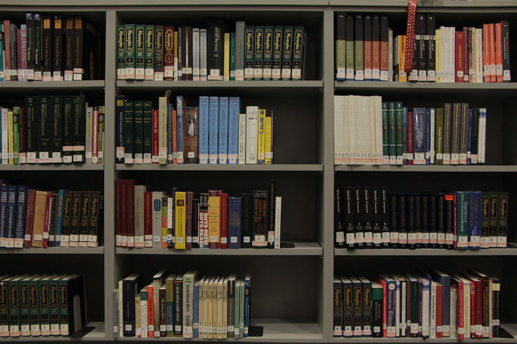 Books arranged in shelves at library