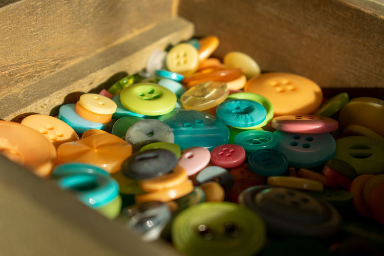 Close-up of buttons in container
