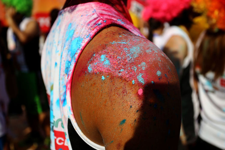 Close-up of paint on man shoulder