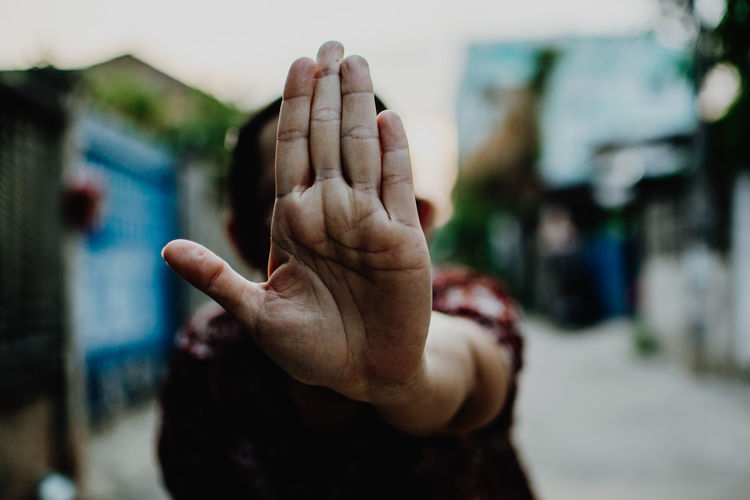 Close-up of woman hand with stop sign 