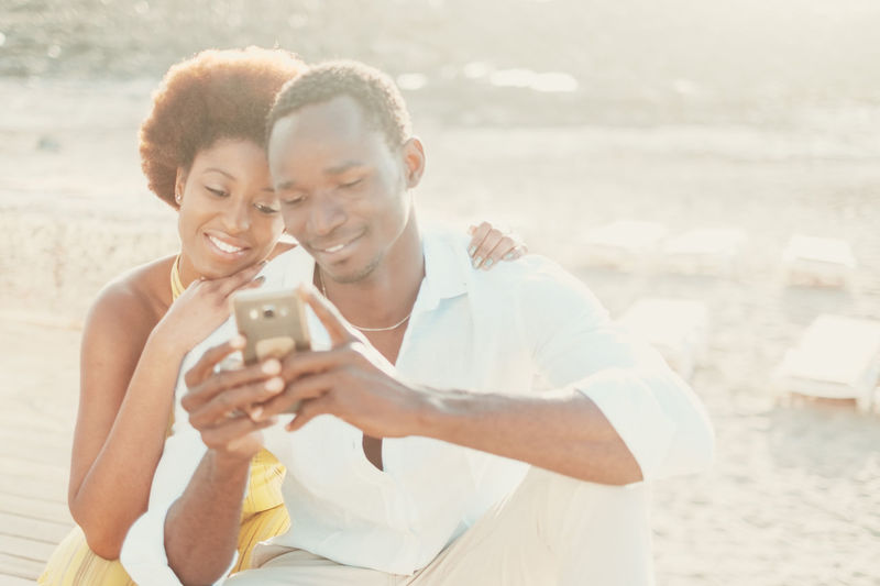 Side view of woman using mobile phone