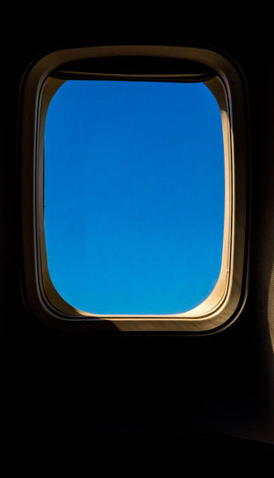 Directly below shot of sky seen through airplane window