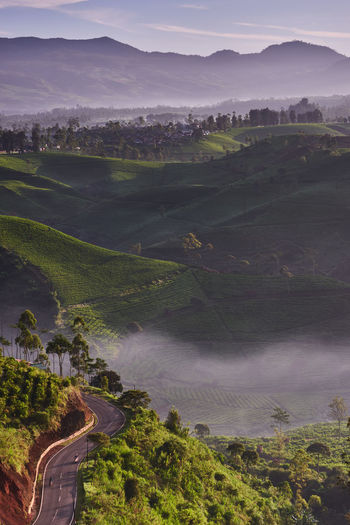 High angle view of road amidst landscape against sky