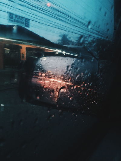 Wet car window in rainy season