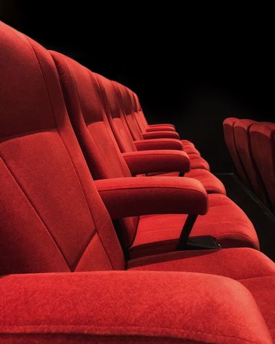 Empty red seats at theater