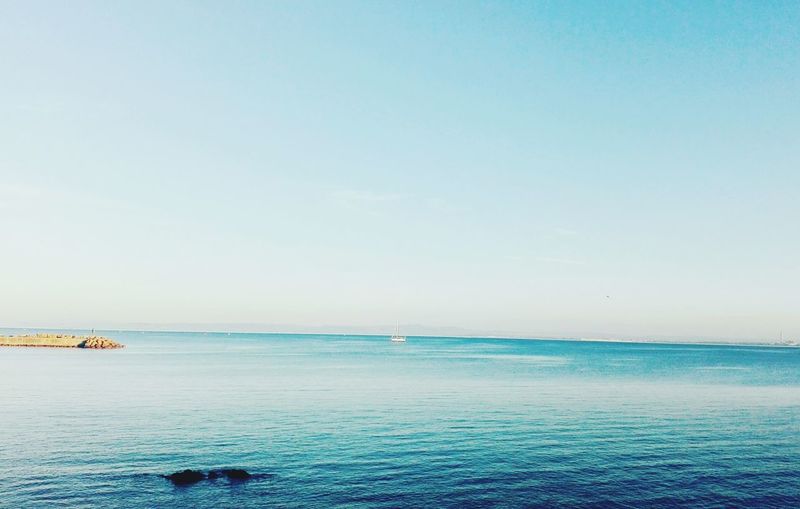 Scenic view of sea against clear sky