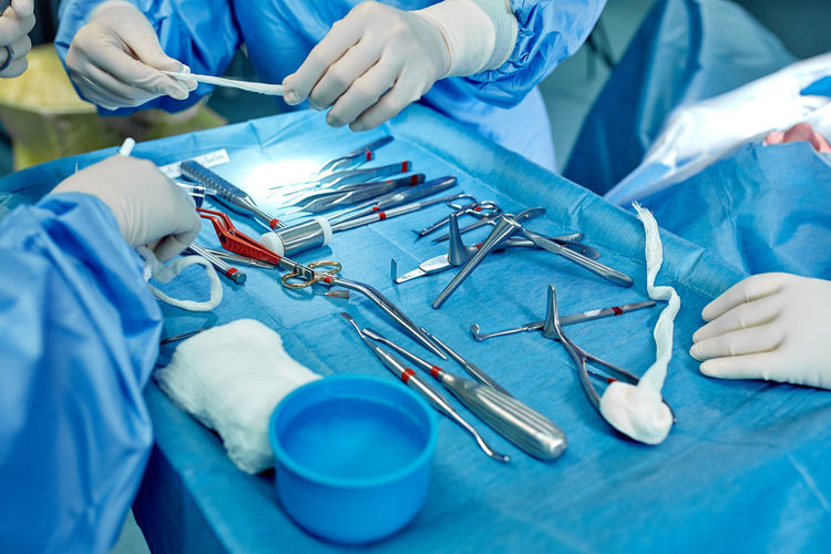 Midsection of surgeons in operating room