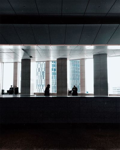 Silhouette people in office building
