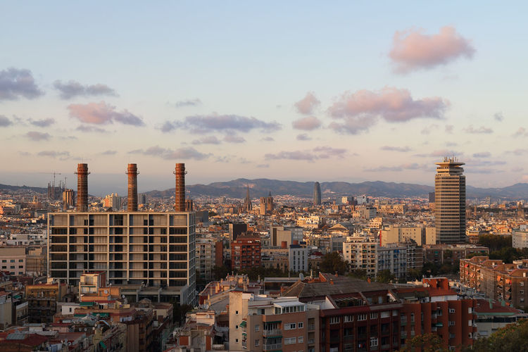 High angle view of buildings in city against sky