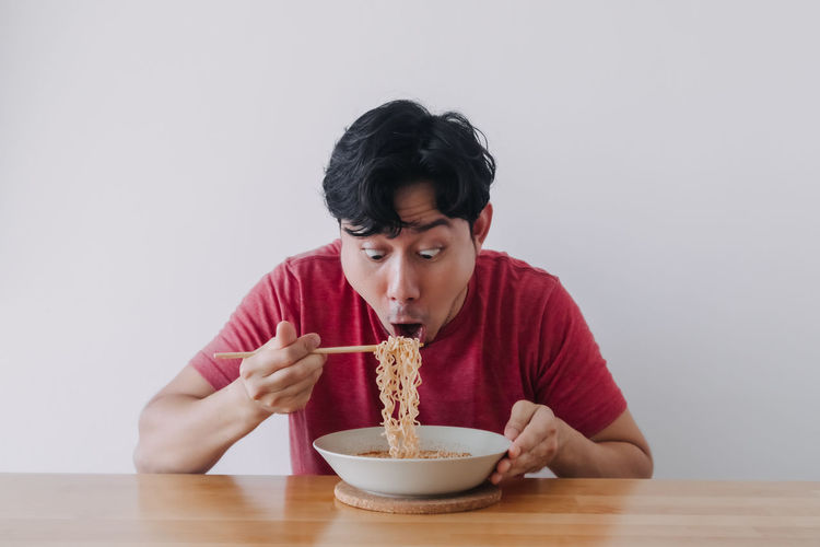 Portrait of man eating food