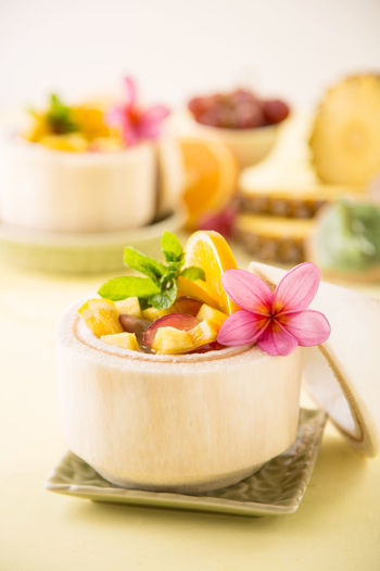 Fruit dessert served in coconut shell