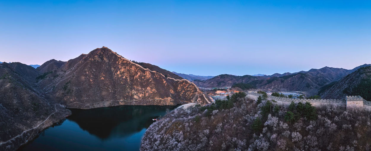 Panoramic view of the great wall and mountains in spring