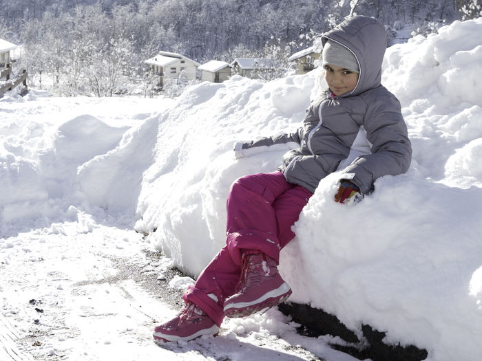 Full length of girl on snow field during winter