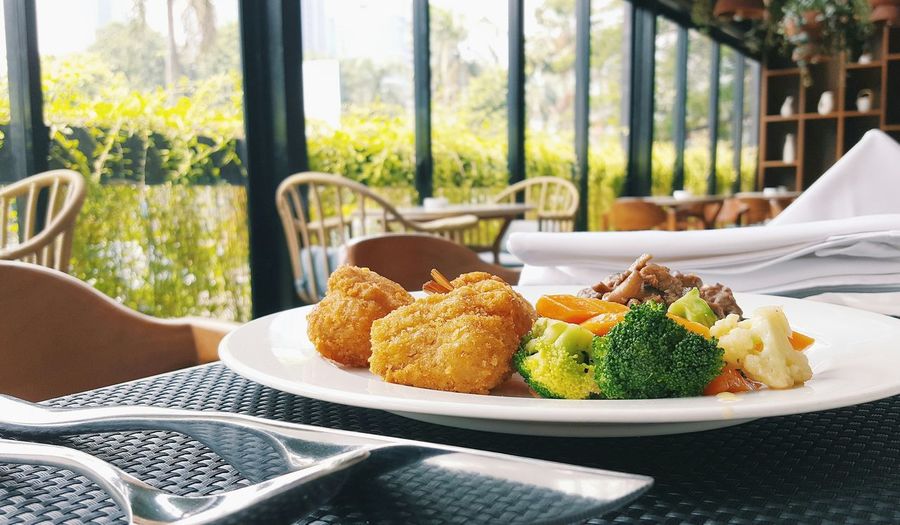 Meal served in plate on table at restaurant