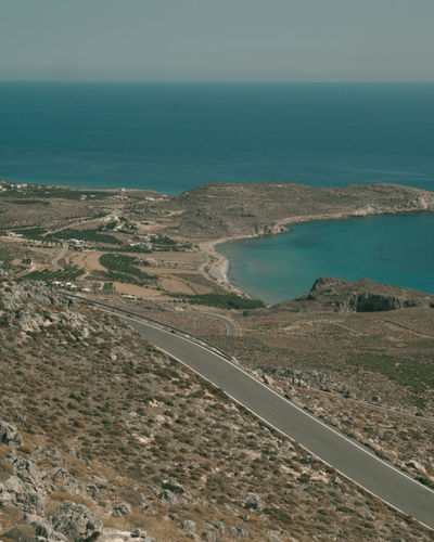 High angle view of road by sea against sky