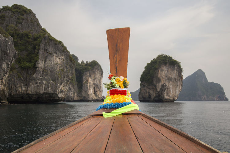 Colorful garland on front of thai long tail boat at ao nang bay