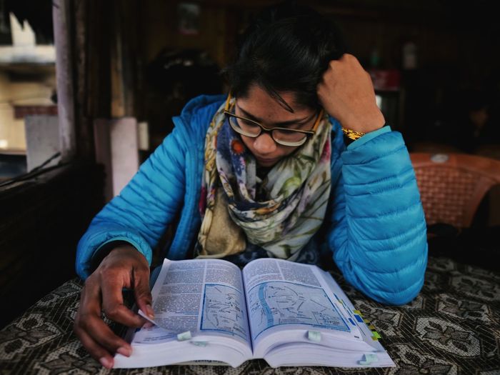 Young man studying at table
