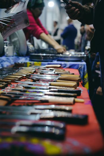 Kitchen knives on table for sale at market stall