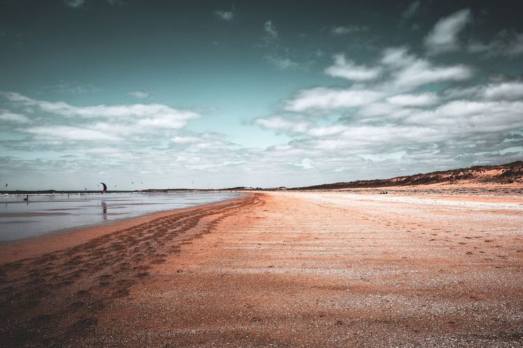 Scenic view of beach against sky
