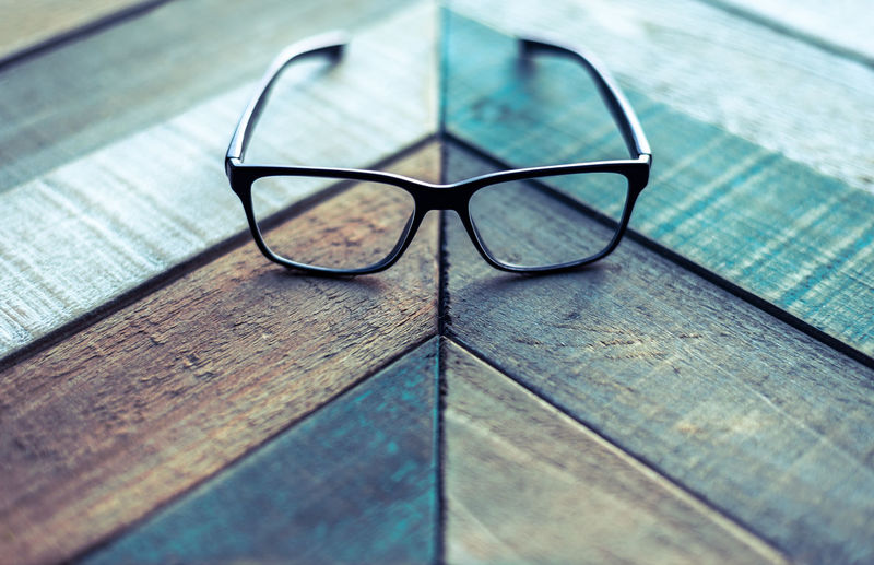 High angle view of eyeglasses on wooden table