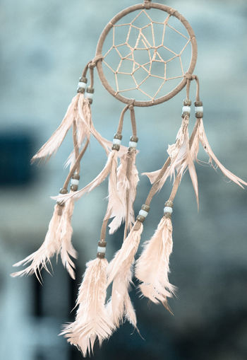 Close-up of dreamcatcher hanging outdoors