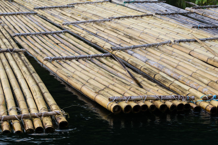 Close-up of bamboo raft in water