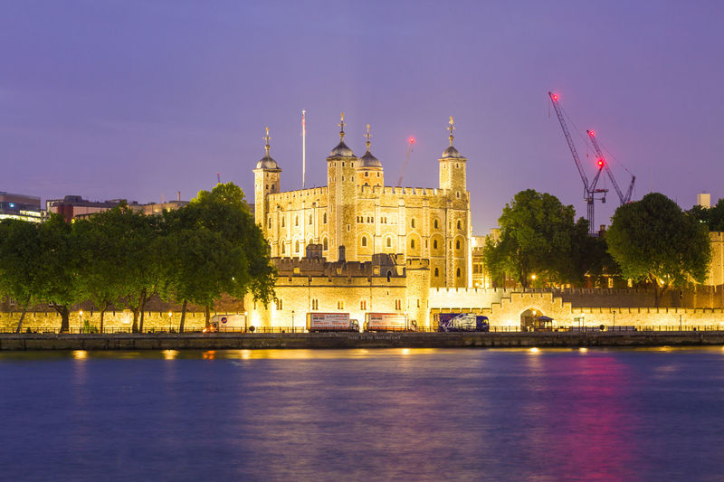Illuminated buildings in city at night