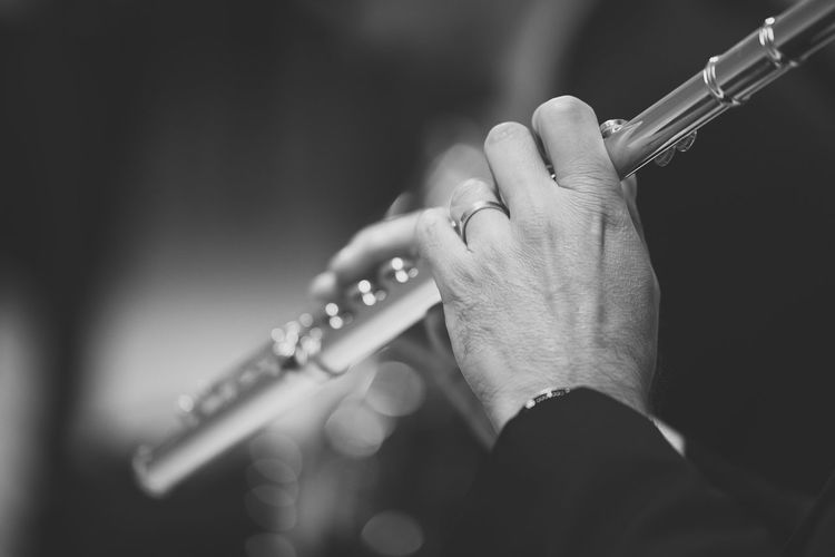 Cropped image of man playing clarinet