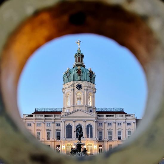 Charlottenburg palace seen through hole against clear sky