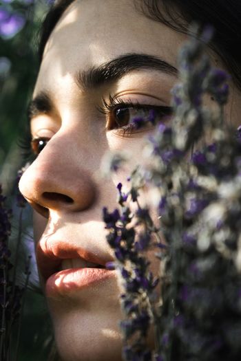 Close-up of woman by plants