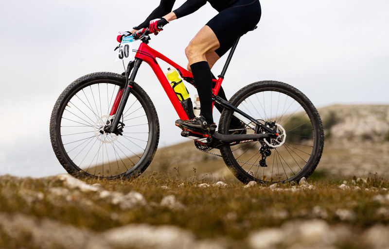 Man riding bicycle on field