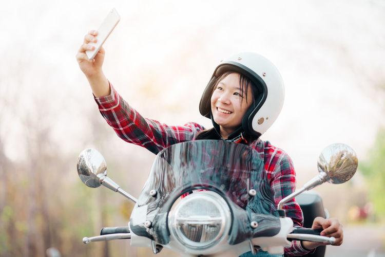 Portrait of young woman using mobile phone