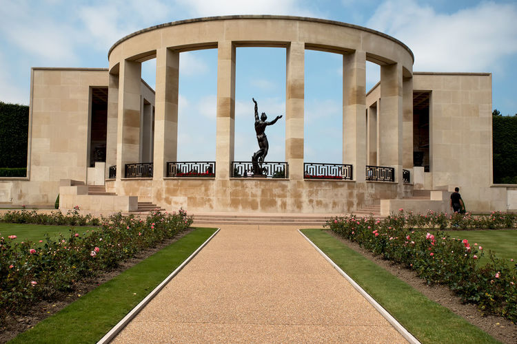 Footpath leading towards built structure at normandy american cemetery and memorial