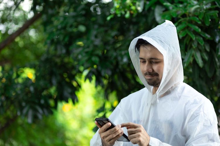 Man using mobile phone outdoors
