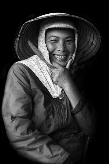 Portrait of smiling young woman wearing hat