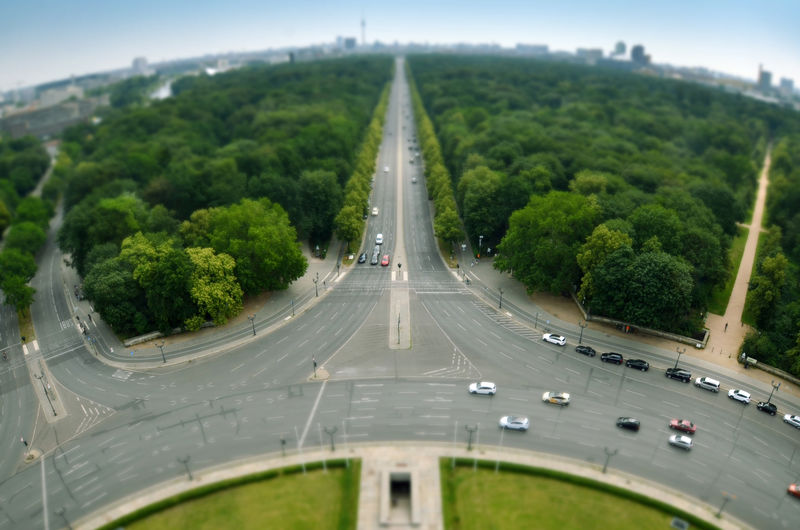 Aerial view of highway amidst trees in city