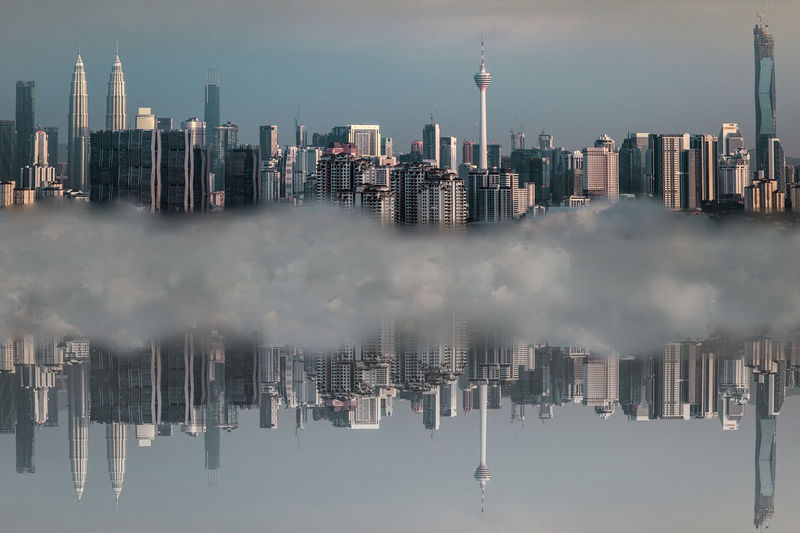 Panoramic view of city skyline against sky