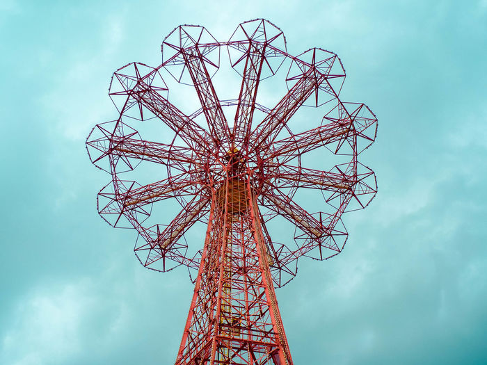Low angle view of amusement park ride against sky