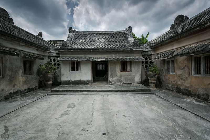 Old building against cloudy sky