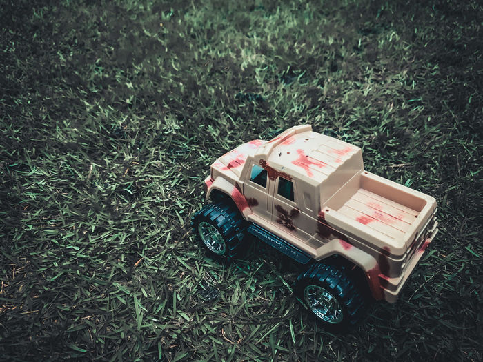High angle view of toy car on field