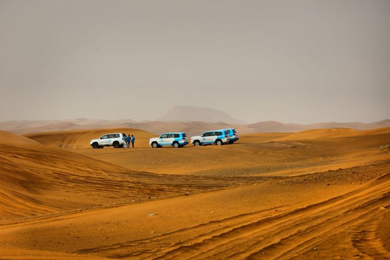 View of car on desert land