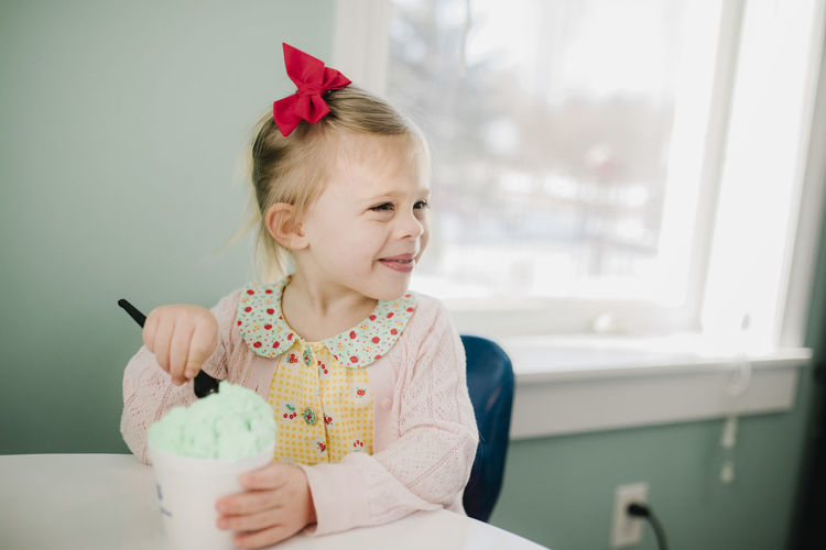 Girl happy to be eating ice cream