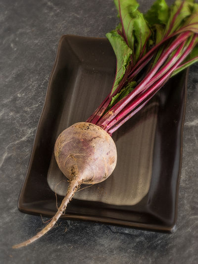 Close-up of beetroot in tray on table