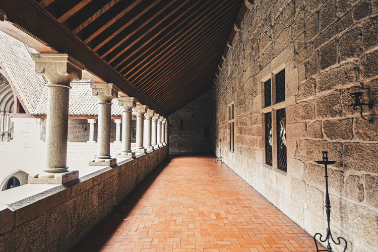 Empty alley amidst buildings