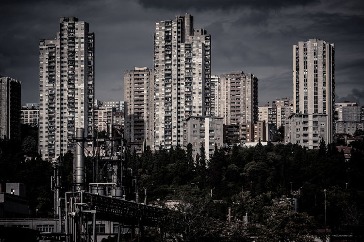 Low angle view of skyscrapers against sky at night