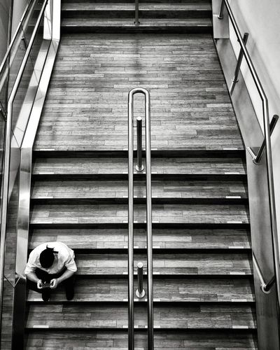 High angle view of man on escalator