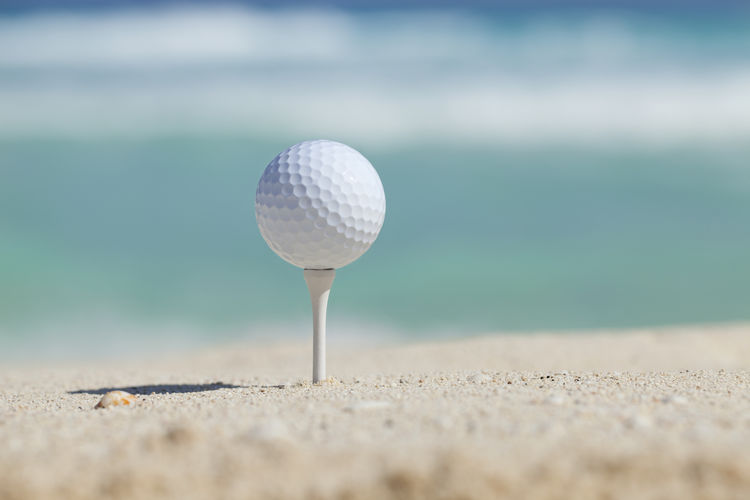 Close-up of golf ball on tee