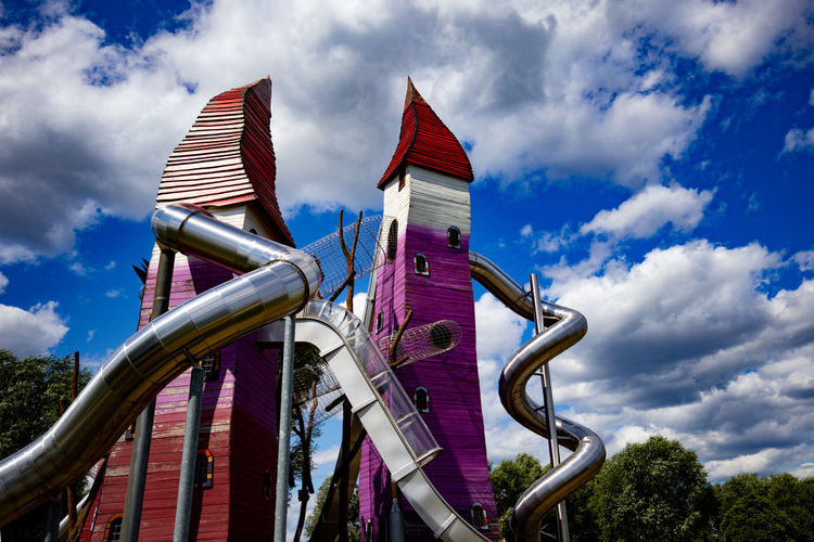 Low angle view of sculpture in park against sky